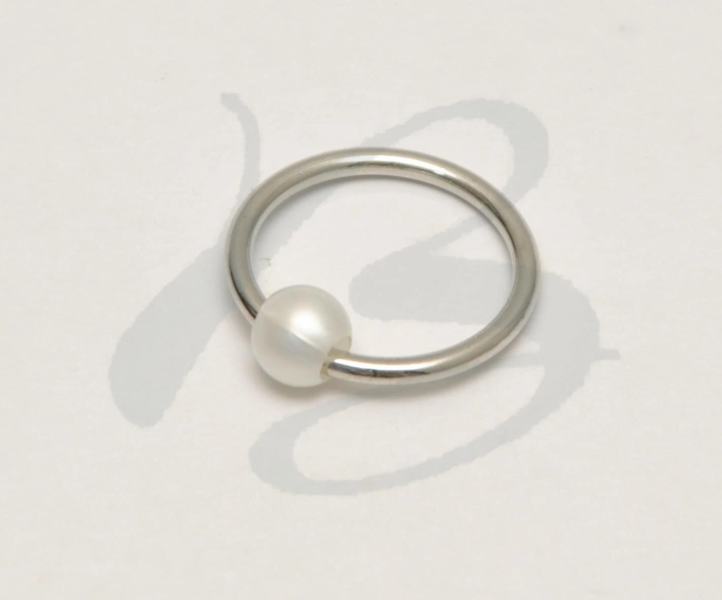 ZAMAK PIERCING HOLDER WITH NYLON SPHERE 22 mm IN VARIOUS COL OURS